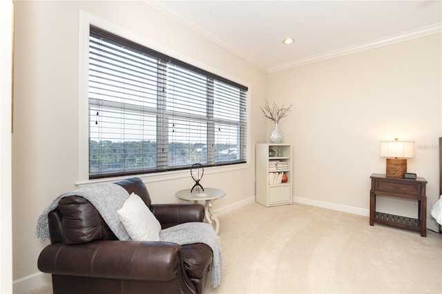 sitting room with light carpet and crown molding