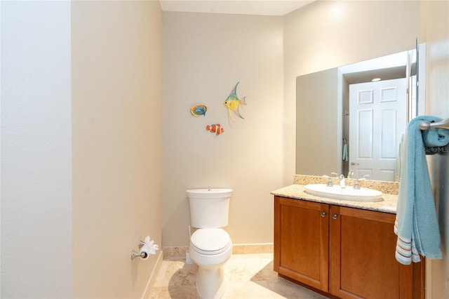 bathroom with oversized vanity, toilet, and tile floors