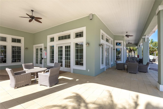 view of patio featuring french doors, an outdoor living space, and ceiling fan