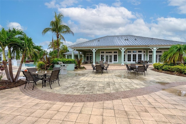 rear view of house featuring french doors and a patio area