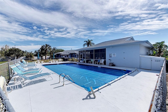 view of swimming pool with a patio