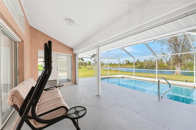 view of pool with a water view