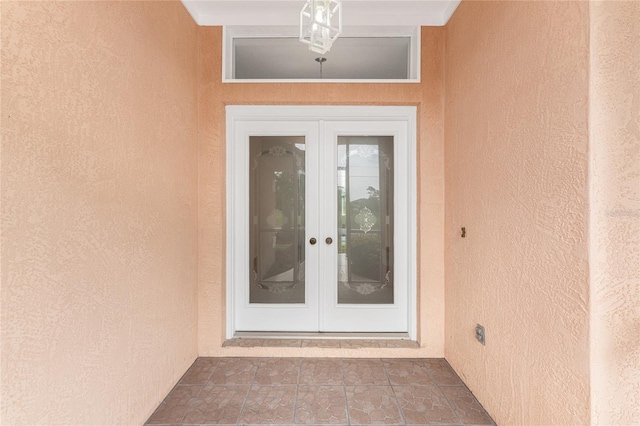 property entrance featuring french doors