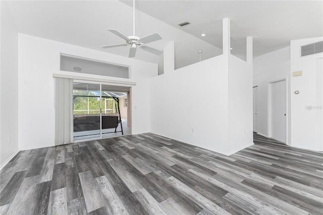 unfurnished living room featuring dark hardwood / wood-style floors, ceiling fan, a textured ceiling, and high vaulted ceiling