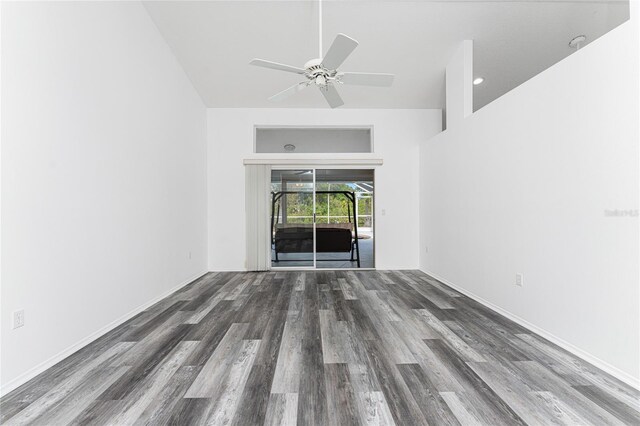 unfurnished living room with ceiling fan and dark hardwood / wood-style flooring