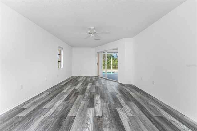 unfurnished room with dark hardwood / wood-style floors, ceiling fan, and a textured ceiling