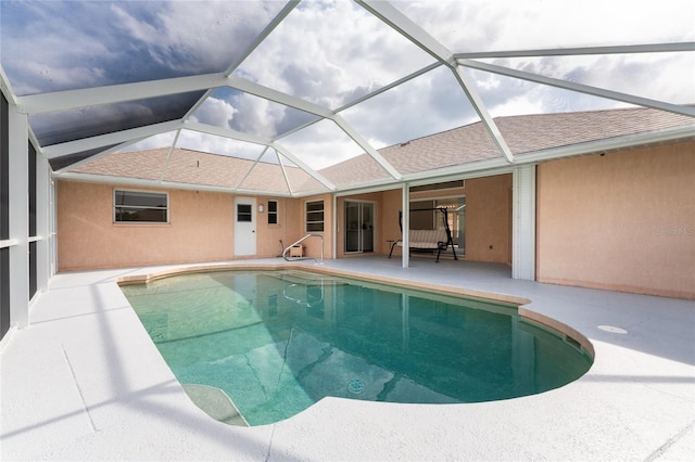 view of pool featuring a lanai and a patio