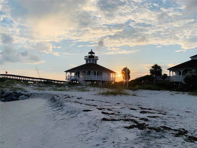 view of back house at dusk