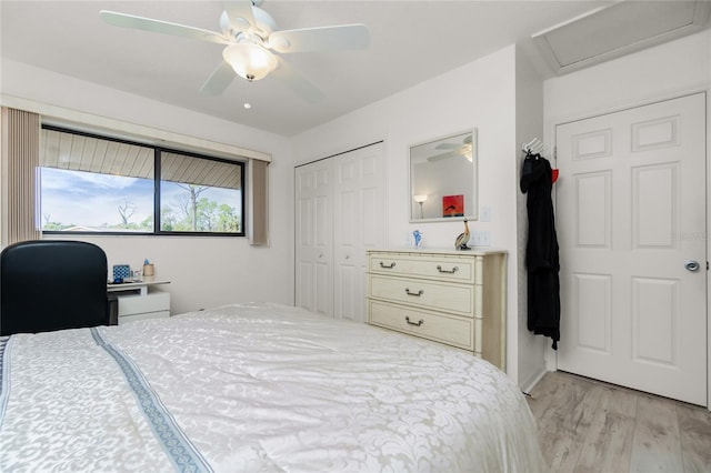 bedroom featuring a closet, ceiling fan, and light hardwood / wood-style flooring