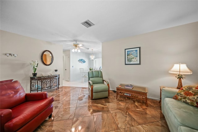 tiled living room with ceiling fan