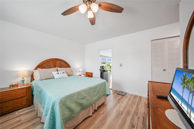 bedroom with ceiling fan, light hardwood / wood-style floors, and a closet