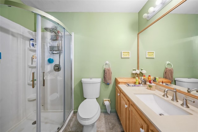 bathroom with tile floors, walk in shower, toilet, and vanity