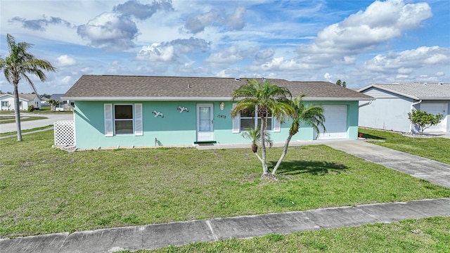 ranch-style house with a front yard and a garage