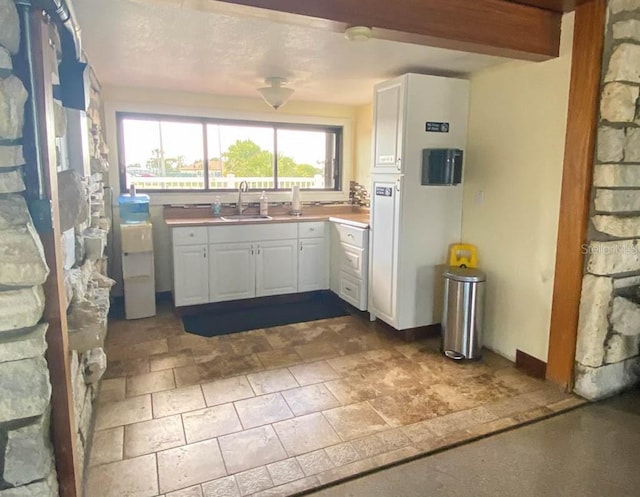 kitchen with sink and white cabinets