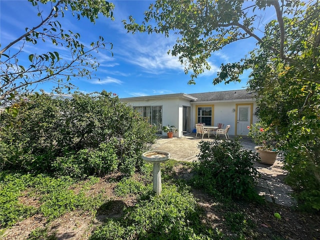 back of property featuring a patio area