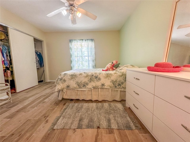 bedroom with a closet, ceiling fan, and light hardwood / wood-style flooring