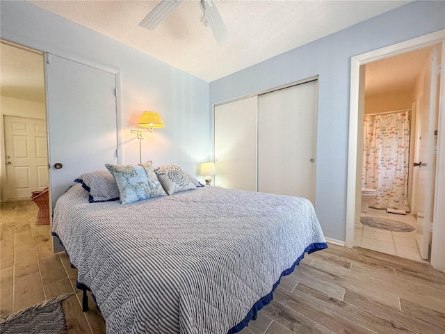 bedroom with ceiling fan, a closet, and a textured ceiling