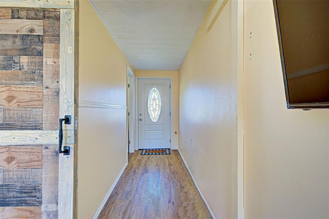 entryway with hardwood / wood-style flooring