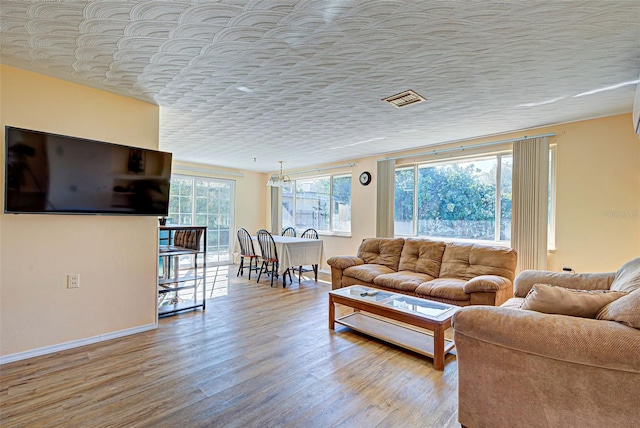 living room featuring a healthy amount of sunlight and light wood-type flooring