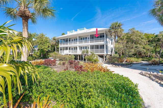 back of property with a balcony