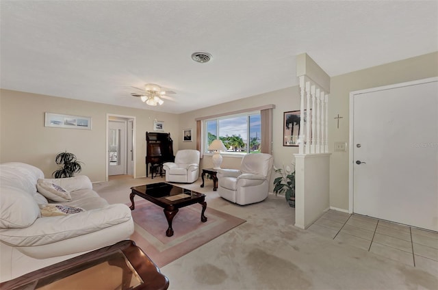 living room with light carpet and ceiling fan