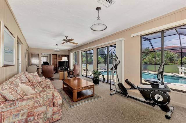 living room featuring ceiling fan and light colored carpet