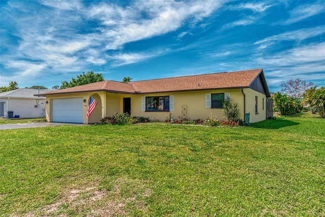 ranch-style house featuring a front yard and a garage