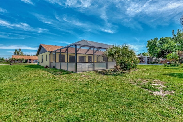 view of yard with glass enclosure