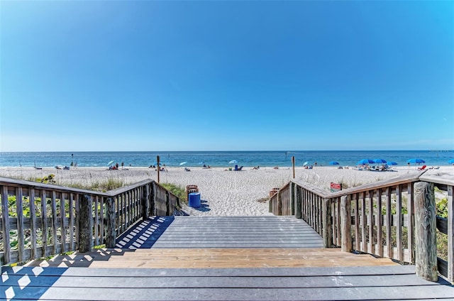 property view of water featuring a beach view