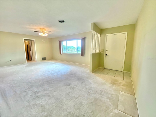 spare room with light colored carpet