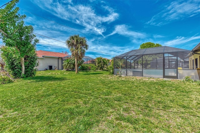 view of yard with a lanai