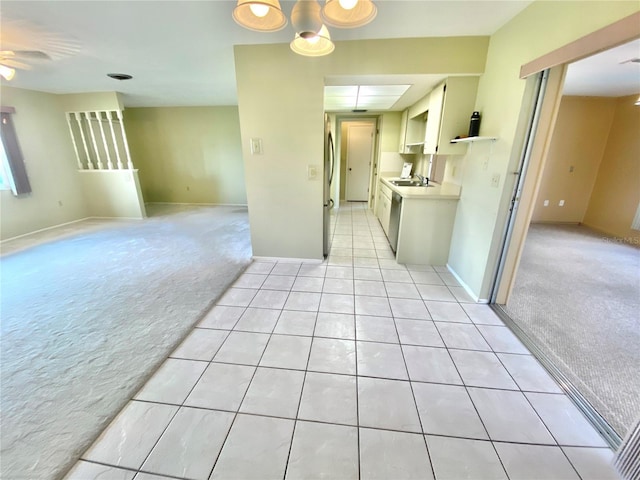 carpeted empty room featuring sink