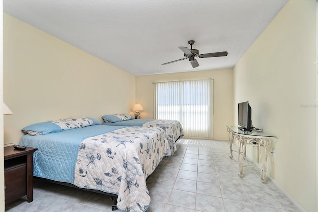 bedroom featuring ceiling fan and light tile patterned floors