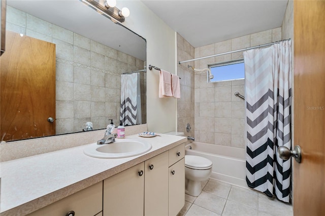 full bathroom featuring tile patterned flooring, vanity, shower / bath combination with curtain, and toilet