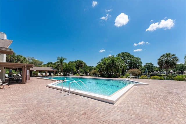 view of swimming pool with a patio area