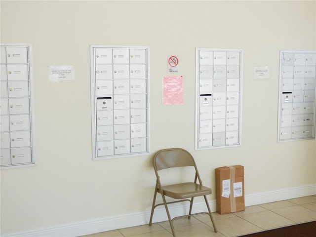 sitting room with tile patterned flooring and mail boxes