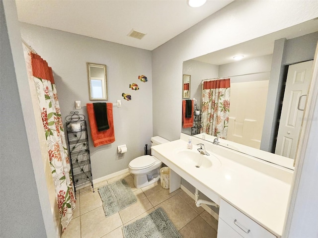 full bathroom with tile patterned floors, toilet, sink, and shower / tub combo with curtain