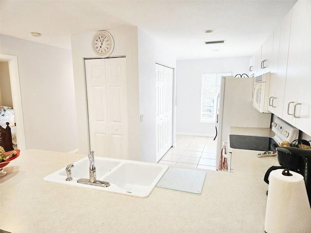 bathroom featuring tile patterned floors and sink