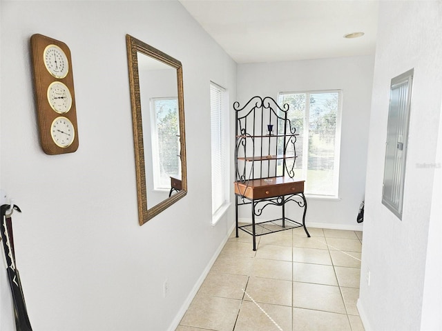 hall with light tile patterned floors