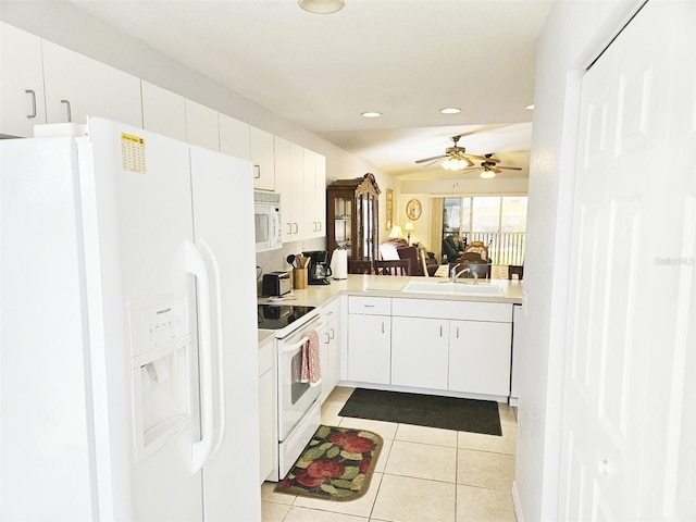 kitchen featuring ceiling fan, sink, white cabinets, and white appliances