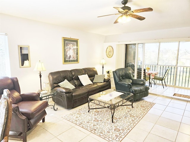 tiled living room with ceiling fan