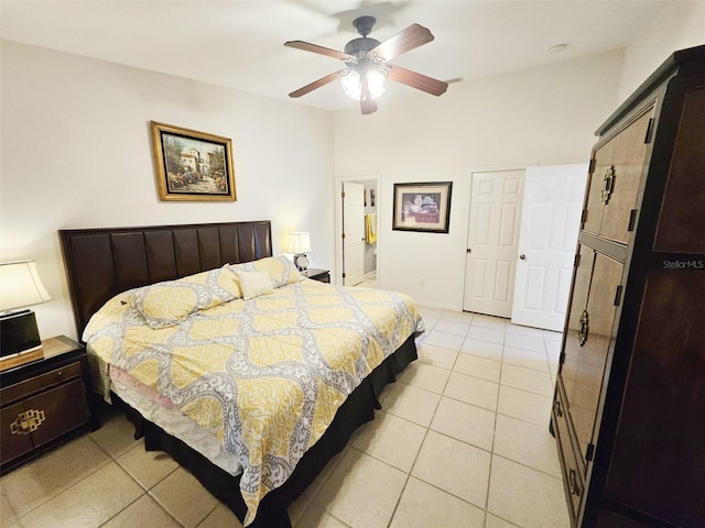 tiled bedroom with ceiling fan