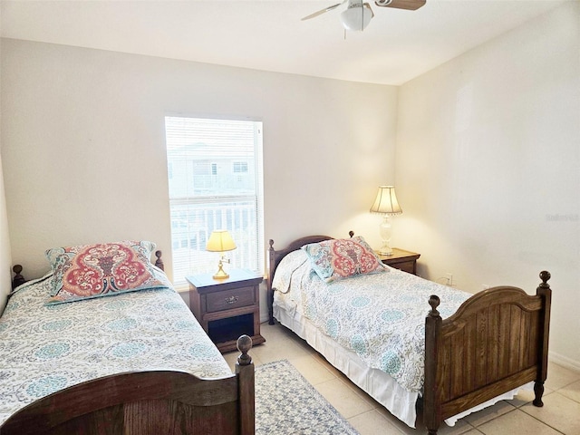 tiled bedroom with ceiling fan