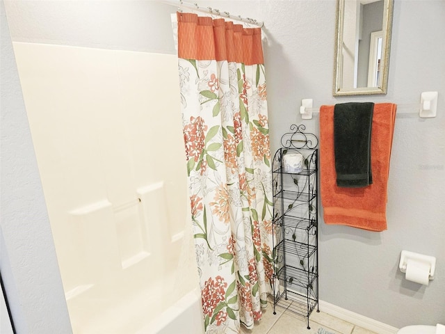 bathroom featuring tile patterned flooring and shower / bath combination with curtain