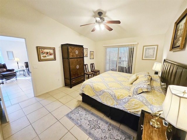 bedroom featuring ceiling fan, light tile patterned floors, and lofted ceiling