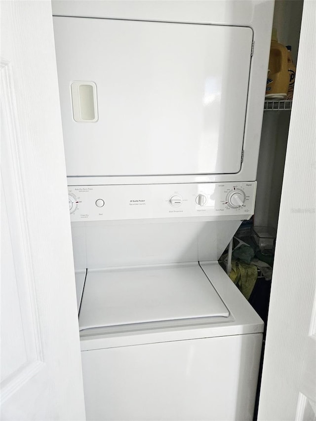 washroom with stacked washer / dryer