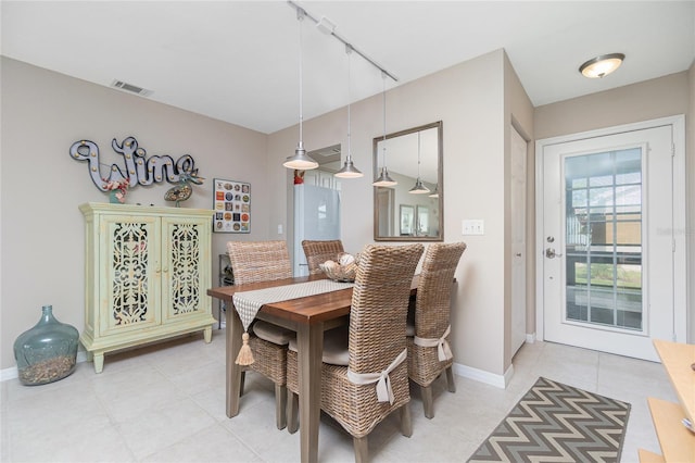 dining space with rail lighting