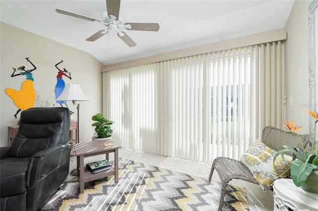 living room with ceiling fan and vaulted ceiling