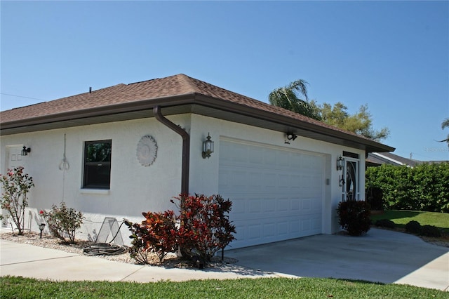 view of side of home featuring a garage