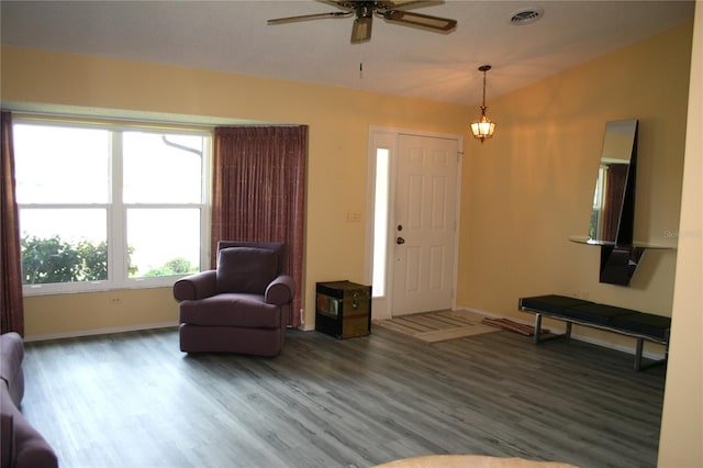 foyer with hardwood / wood-style floors, ceiling fan, and vaulted ceiling